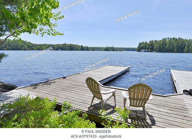 Dock and Muskoka Chairs on Lake Muskoka,  Ontario