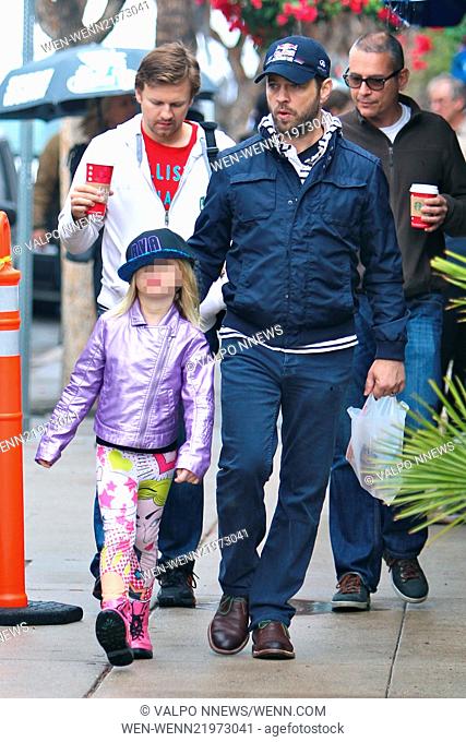 Jason Priestley takes a walk in the rain with his family through Studio City Featuring: Jason Priestley, Ava Veronica Priestley Where: Studio City California
