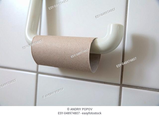 Close-up Of Finished Toilet Paper Roll In Bathroom