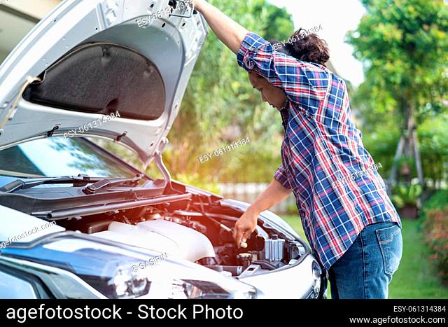 Open hood mechanic engine system to check and repair damage car crash