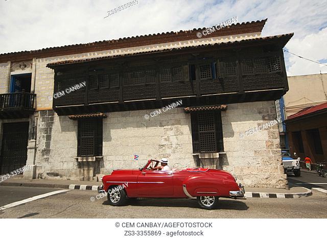 Vintage American car in front of the Art Museum-Museo De Arte at Parque Cespedes, Santiago de Cuba, Cuba, Central America