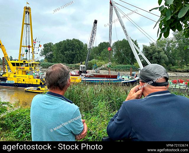 the scene of the salvaging works to bring the Dutch barge that sunk last week on the Schelde river to the surface, in Grembergen near Dendermonde