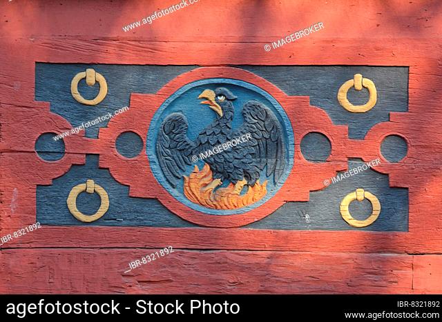 Wood carving with firebird at the historic Amthof in Bad Camberg, Hesse, Germany, Europe