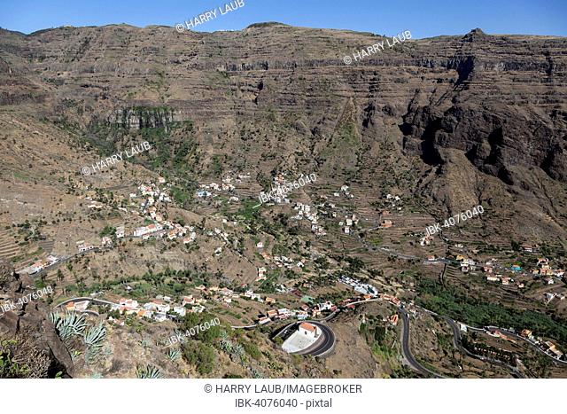 View from Mirador Cesar Manrique onto terraced fields and houses of Lomo del Balo and La Vizcaina, Valle Gran Rey, La Gomera, Canary Islands, Spain