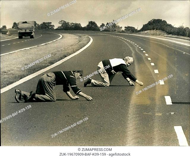 Sep. 09, 1967 - Starting a slow crawl on the M5. After Lorry spills filings for 25 miles.: The two men in the picture know what its like to be in a crawl on the...