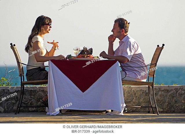 Couple at dinner, Matemo Island Resort, Quirimbas Islands, Mozambique, Africa