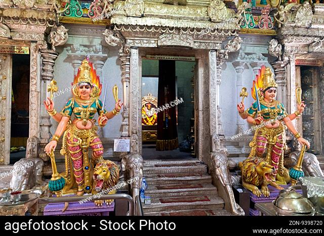 Singapore, Singapore - January 31, 2015: Statues at the entrance to the Hindu temple in the district Little India