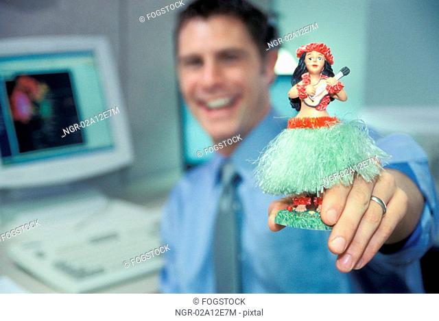 Office Worker With Hula Dancer Toy