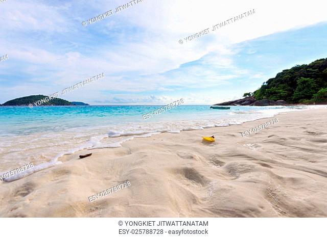 Visitors footprints on sand at beach near the sea during morning high tide remove traces of the chaos return to peaceful in Koh Miang island