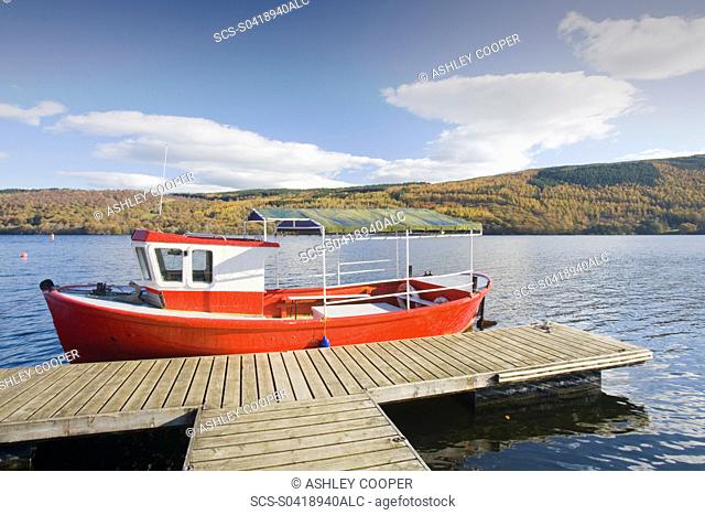 Boats moored on Coniston Water in the Lake District UK
