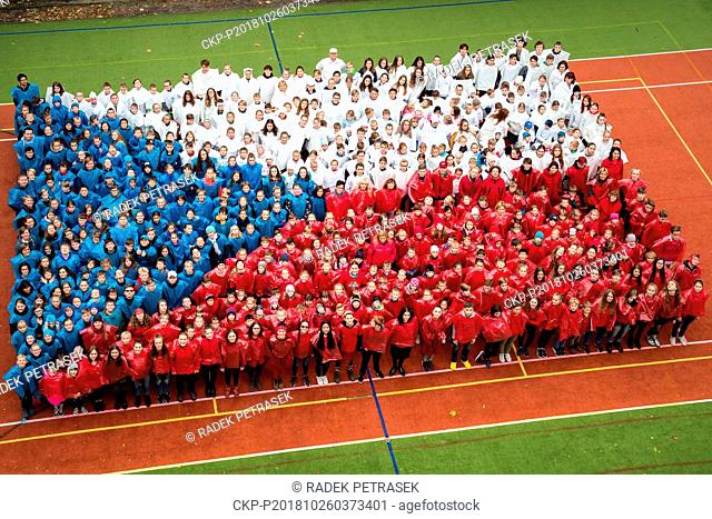 520 pupils and teachers of the Hus elementary school in Liberec dressed in Czech national colors and stand in the form of Czech flag