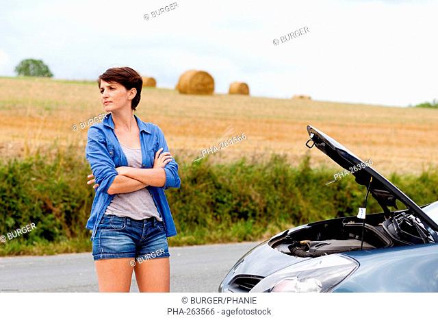 Woman with car trouble
