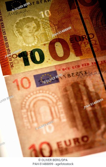 New ten euro banknotes in Duesseldorf, Germany, 28 August 2014. The German Federal Bank has unveiled the new banknotes. Photo: OLIVER BERG/dpa | usage worldwide