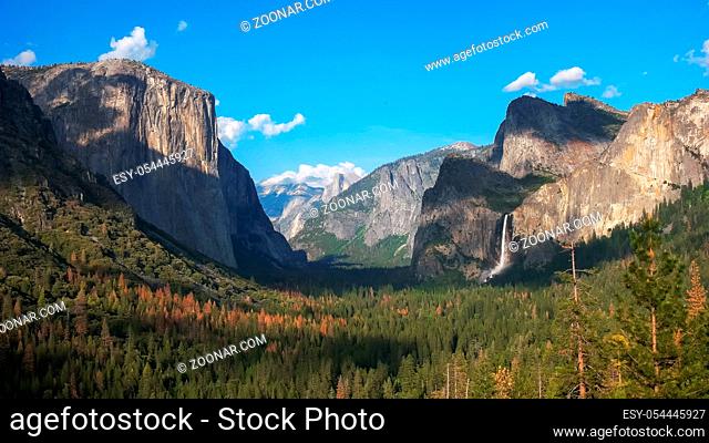 late afternoon view of bridalveil falls and half dome in yosemite national park from tunnel view
