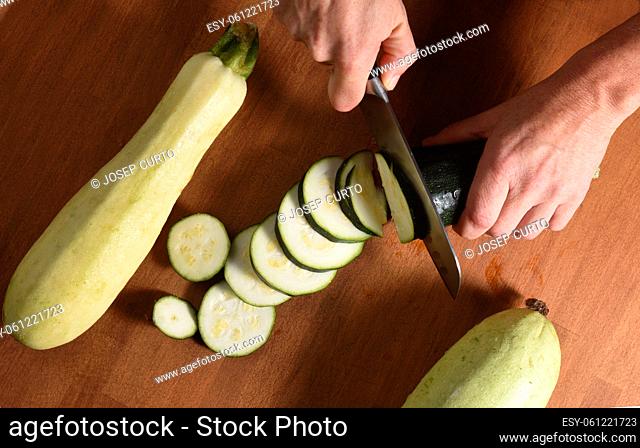 high angle view of the cut of a zucchini on a wood