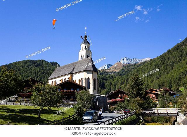 pilgrimage church Maria Schnee in Obermauern, Eastern Tyrol, with paraglider  Europe, central europe, austria, East Tyrol, October 2009
