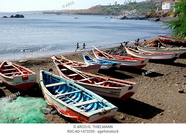Beach, fishing boats, playing children, Cidade Velha, Santiago Island, Ilhas de Sotavento, Cape Verde, Africa