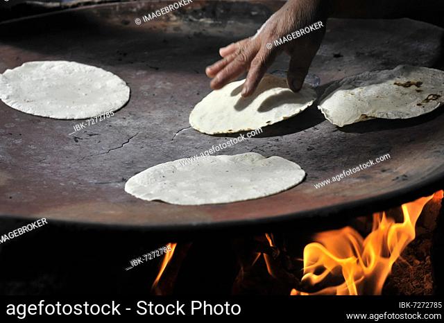 Woman preparing tortilla, restaurant, mezcal extraction, Mitla, Oaxaca, Mexico, Central America
