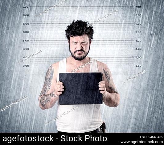 Gangster with rainy, lowering background and table on his hand