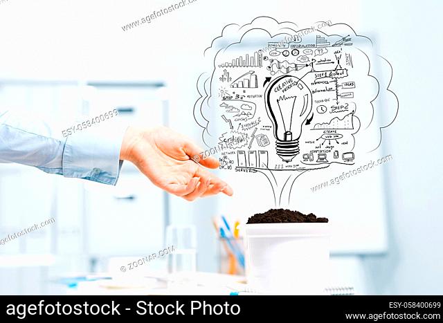 Hand of business person pointing at plan for income growth