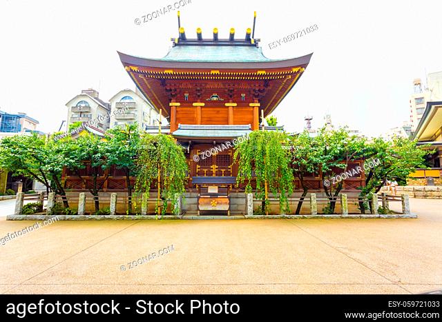 Rear of the historic Yushima Tenman-Gu Shinto shrine on a sunny summer day in Tokyo, Japan