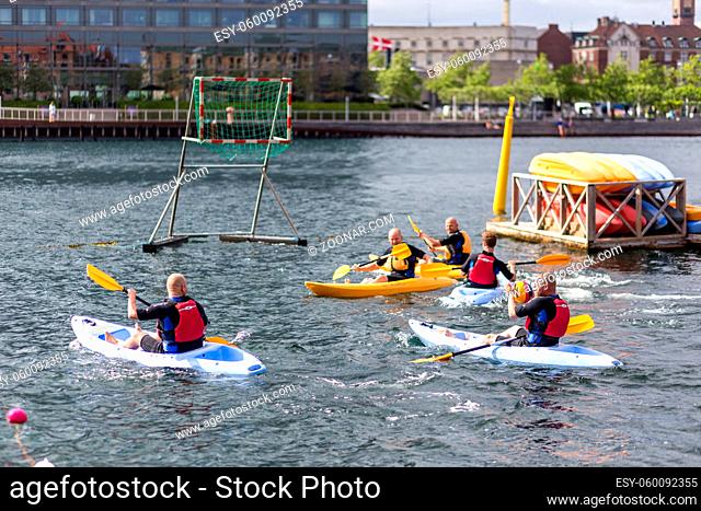 Copenhagen, Denmark - June 20, 2017: Group f men playing kayak polo in Copenhagen harbor