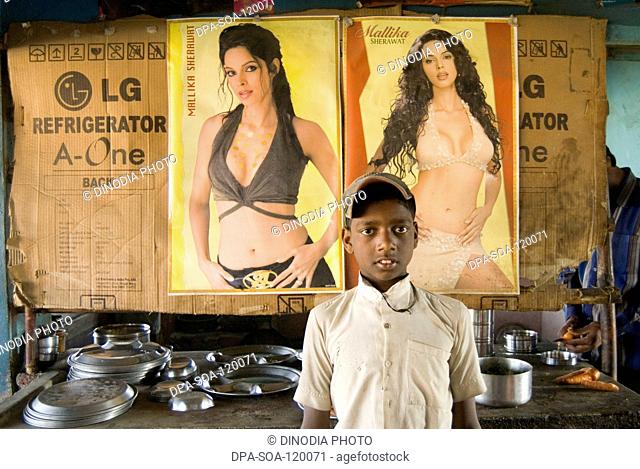 Boy with hindi film actress poster at dhaba on highway; Jharkhand ; India