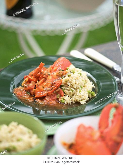 Lobster in tomato sauce with rice and peas