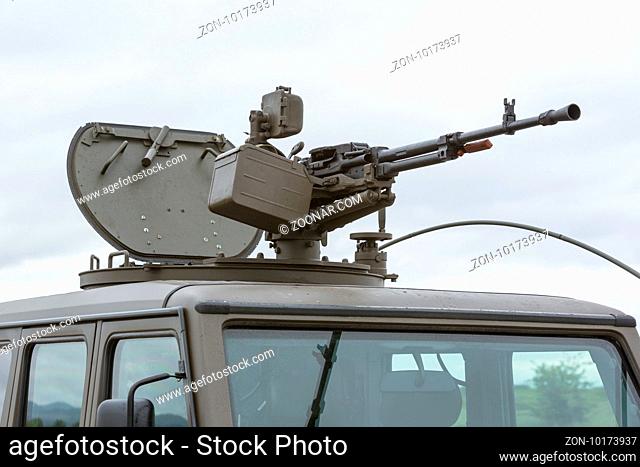 Military vehicle with heavy machine gun. Growler - an internally transportable light strike vehicle. Light utility, light strike and fast attack vehicle