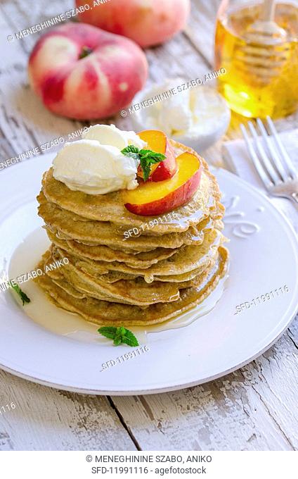 Pancakes with peach, cream cheese and honey