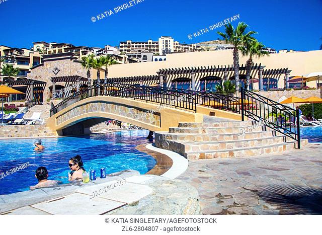 Gorgeous view of the Resort in Cabos San Luca, Baja California, Mexico. View of the ocean, and many infinity pools, people enjoying drinking in the pool