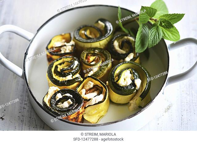 Grilled zucchini rolls with vegan almond cream and fresh mint