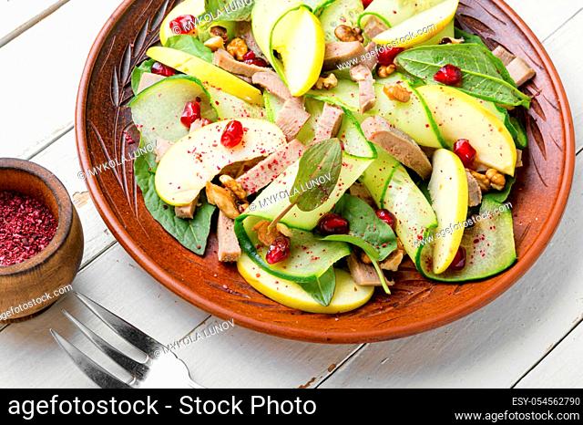 Appetizing salad of vegetables, fruits and meat tongue.Diet food