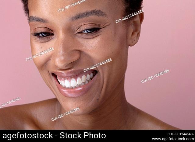 Studio shot of smiling woman