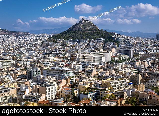 Aerial view from Acropolis of Athens city, Greece. Mount Lycabettus with Church of St George seen on photo