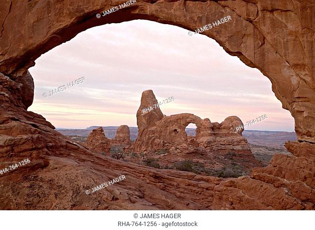 Turret Arch through North Window at dawn, Arches National Park, Utah, United States of America, North America