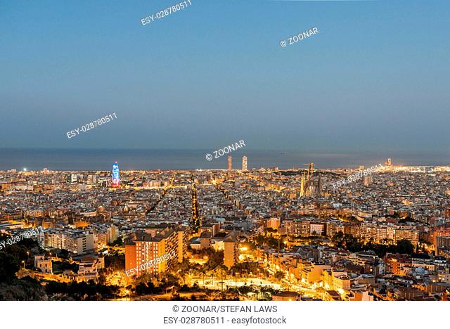 Barcelona at night seen from the Parc del Guinardó on top of a west side hill