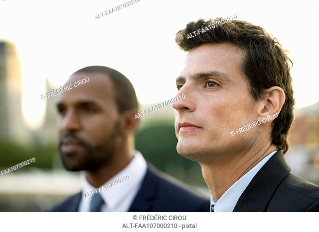 Businessman looking away in thought, portrait
