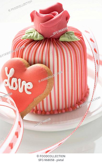 Marzipan-covered cake & heart-shaped biscuit Valentine's Day