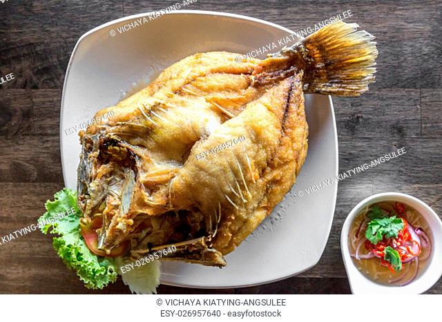deep fried sea bass with fish sauce and spicy salad