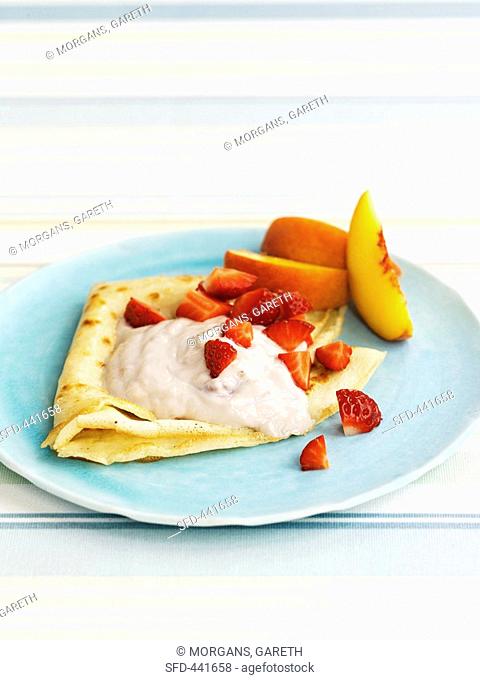 Pancakes with fruit and yoghurt sauce