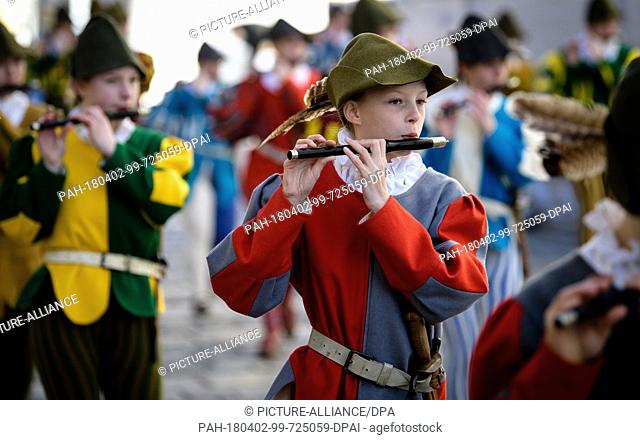 02 April 2018, Germany, Traunstein: Children of a marching band playing during the traditional Georgiritt ('Saint George's equestrian procession') to the...