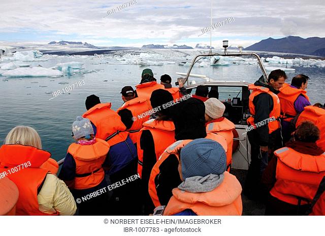 Passengers on a boat tour among icebergs, glacier, Joekulsarlon, Iceland, Europe