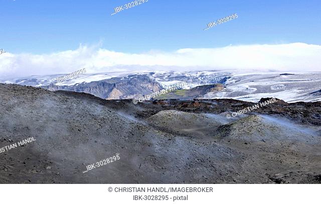 View across new lava fields created by a volcanic eruption in 2010 to the Myrdalsjökull glacier, at the long-distance hiking trail from Skógar via Fimmvörðuhals...