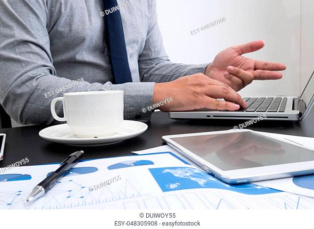 businessman hand working with new modern computer and business