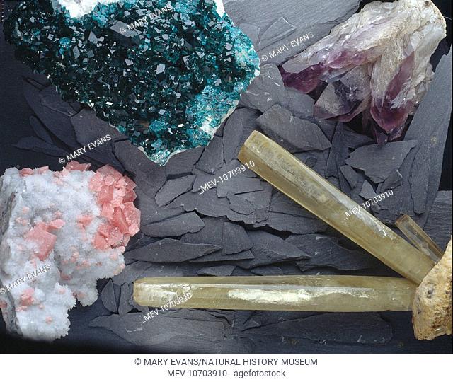 Amethyst, purple crystals from India. Baryte, long yellow prisms from Cumbria. Dioptase, green lustrous crusts from Namibia