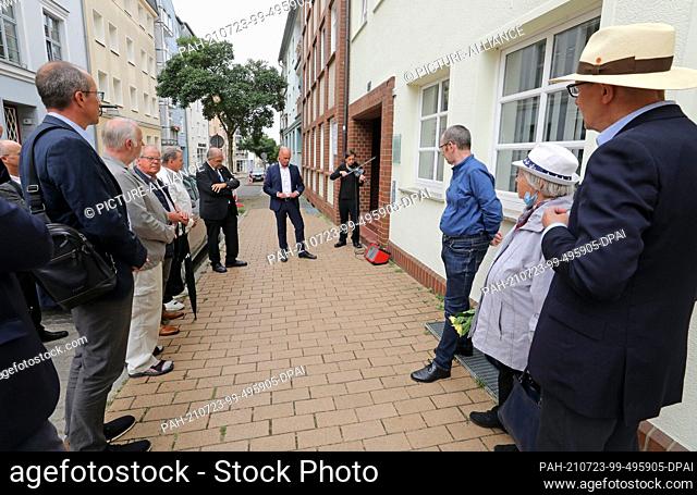23 July 2021, Mecklenburg-Western Pomerania, Rostock: People stand at the dedication of the memorial plaque of Arno Esch, who was executed by the Soviet regime