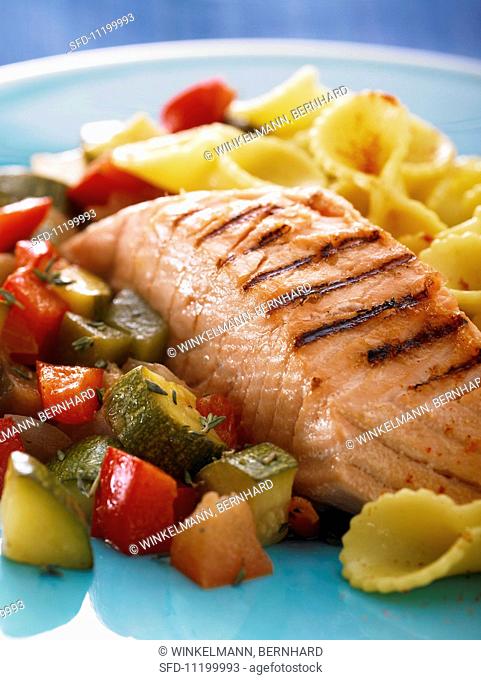 Grilled salmon with vegetables and pasta