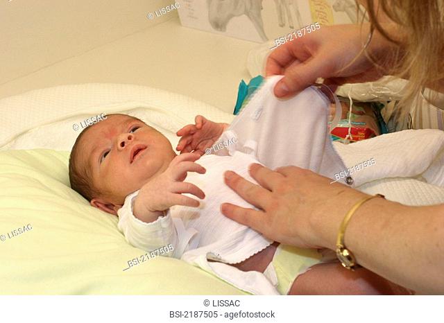 INFANT HYGIENE<BR>New-born baby being changed