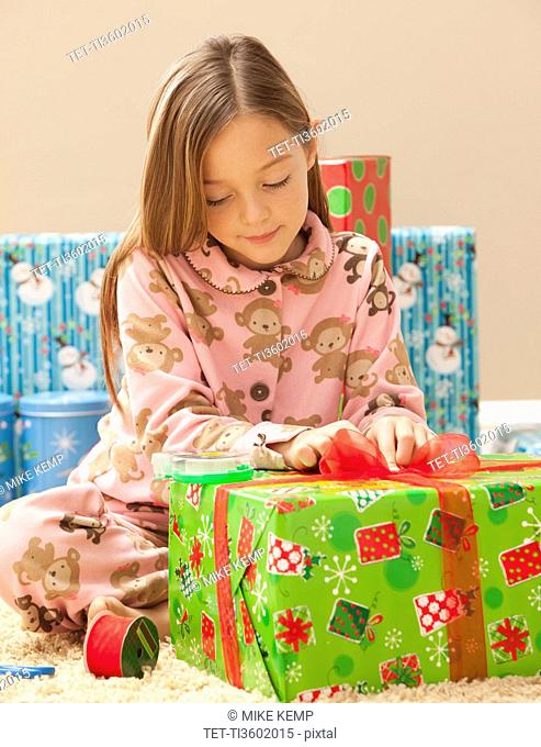 Girl 6-7 preparing Christmas presents